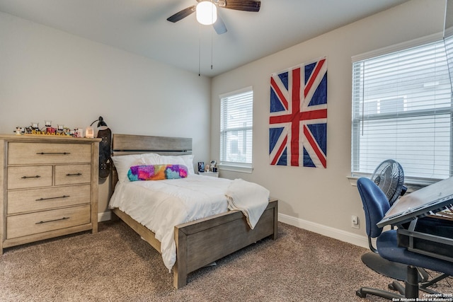 bedroom featuring dark carpet and ceiling fan