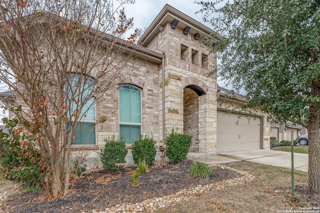 italianate-style house featuring a garage