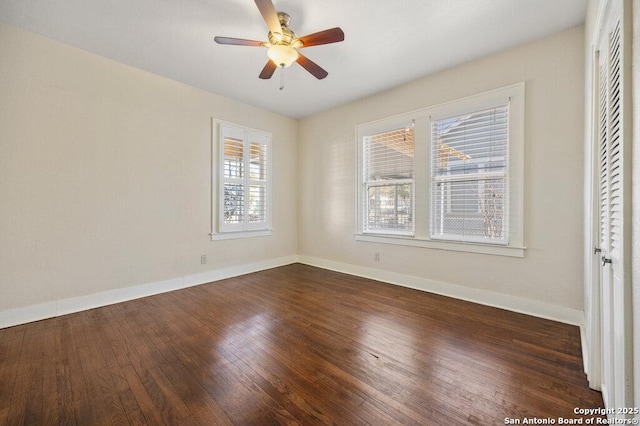 unfurnished room featuring dark hardwood / wood-style flooring and ceiling fan