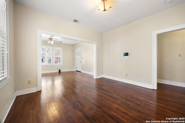 unfurnished room featuring ceiling fan and dark hardwood / wood-style floors