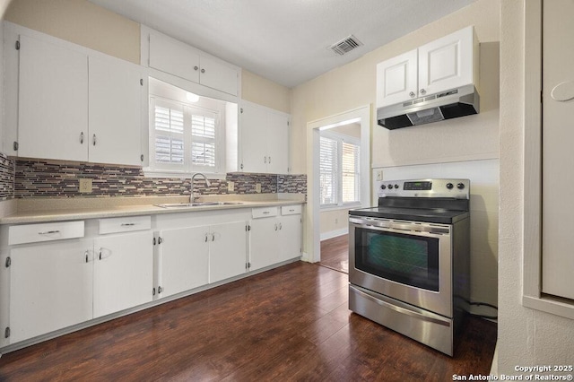 kitchen with white cabinetry, sink, stainless steel electric stove, and tasteful backsplash