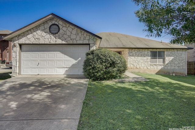 ranch-style home with a garage and a front yard