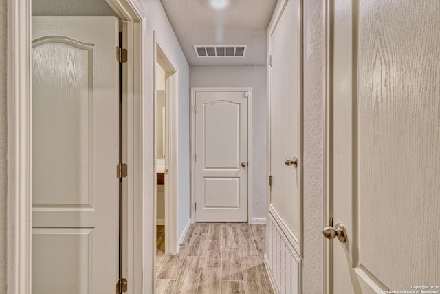 corridor featuring light wood-type flooring