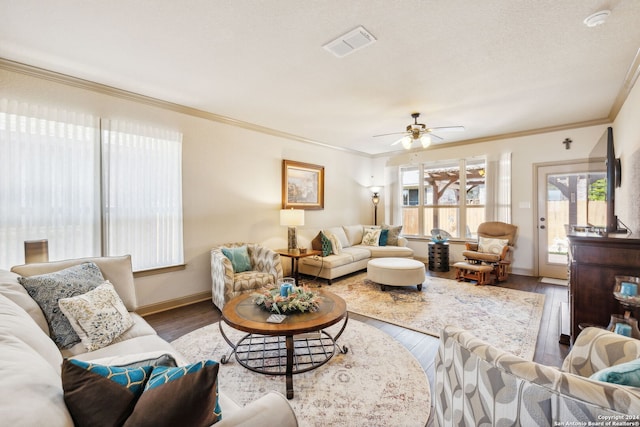 living room featuring ceiling fan, wood-type flooring, and ornamental molding