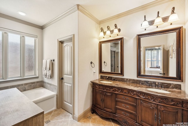 bathroom with tile patterned floors, a tub, crown molding, and vanity