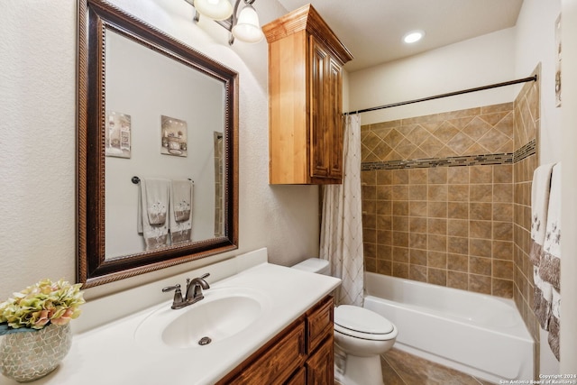 full bathroom featuring shower / tub combo with curtain, vanity, and toilet