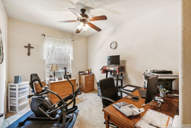 carpeted home office with ceiling fan