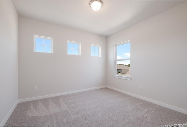 unfurnished room with carpet floors