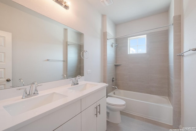 full bathroom featuring tile patterned floors, vanity, toilet, and tiled shower / bath