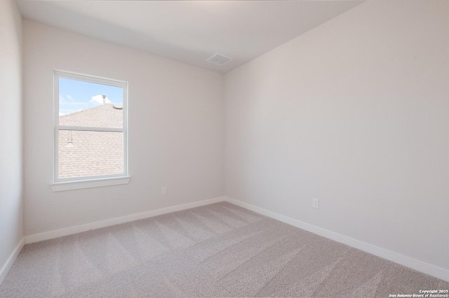 carpeted empty room with a healthy amount of sunlight