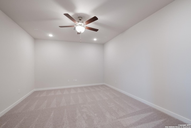 carpeted empty room featuring ceiling fan