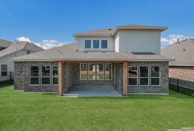 rear view of property with a patio area and a yard