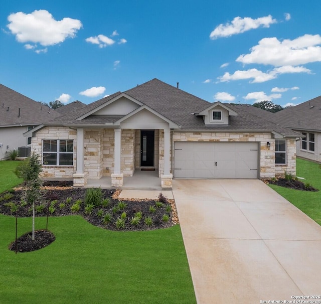 view of front facade with a front yard and a garage