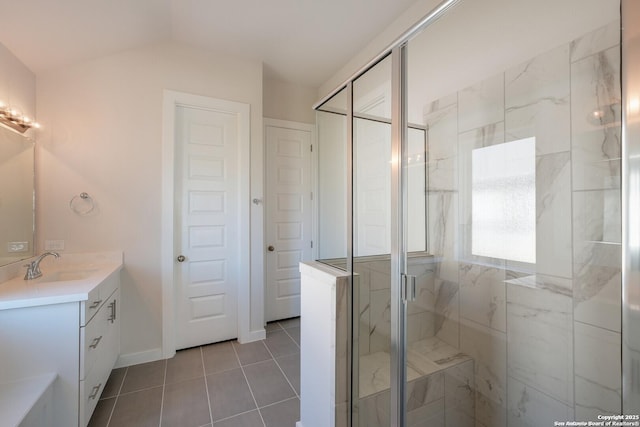 bathroom featuring tile patterned flooring, vanity, and a shower with door