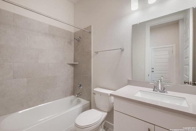 full bathroom with tiled shower / bath combo, toilet, and vanity