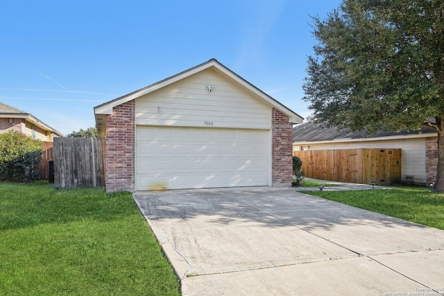 garage featuring a yard