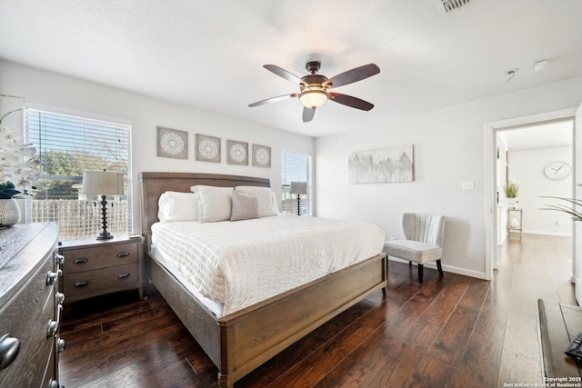 bedroom featuring dark hardwood / wood-style flooring and ceiling fan