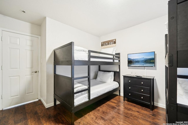 bedroom featuring dark wood-type flooring