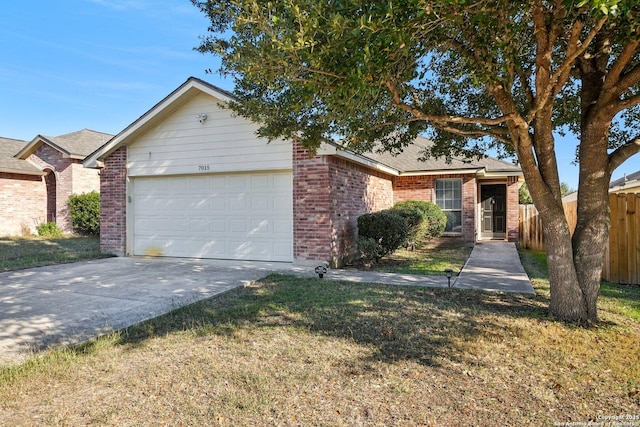 single story home featuring a garage and a front yard