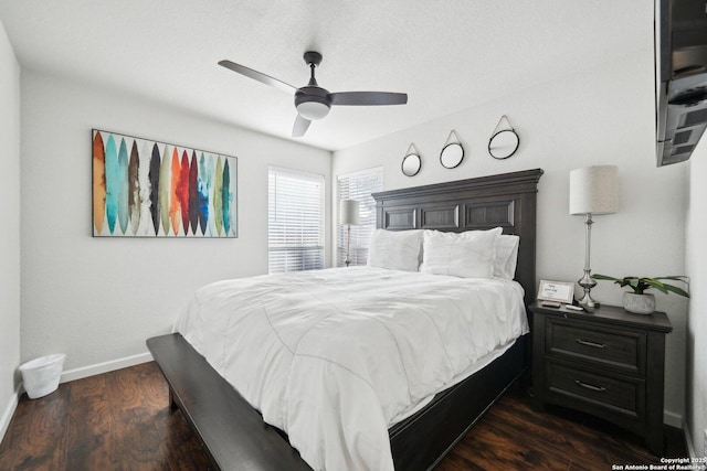 bedroom with ceiling fan and dark hardwood / wood-style flooring