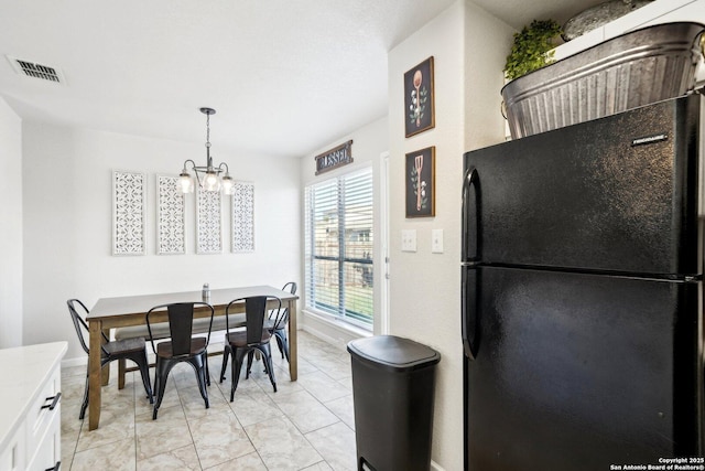 dining room featuring an inviting chandelier