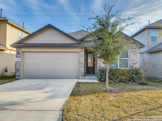 view of front of property with a garage and a front yard