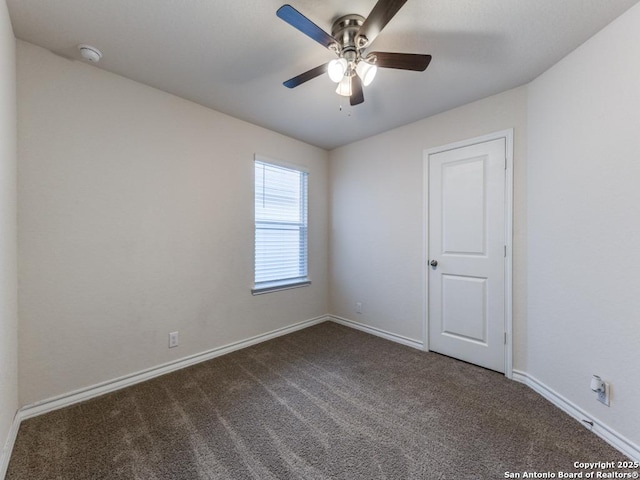 empty room featuring carpet flooring and ceiling fan