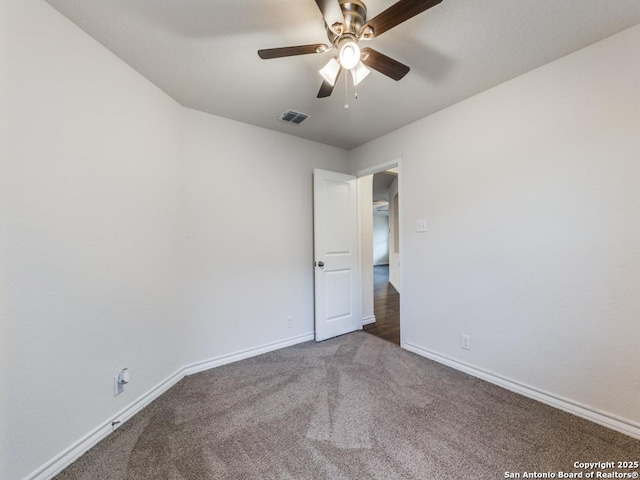 empty room with carpet flooring and ceiling fan