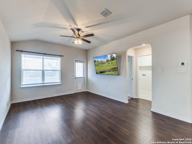 spare room featuring ceiling fan, dark hardwood / wood-style flooring, and lofted ceiling