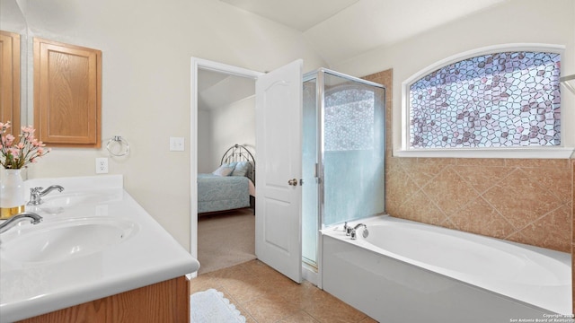 bathroom featuring tile patterned floors, vanity, and independent shower and bath