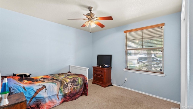 bedroom with ceiling fan and carpet floors