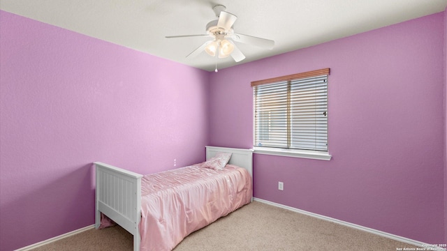 carpeted bedroom featuring ceiling fan