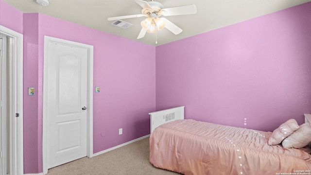 bedroom with ceiling fan and light carpet