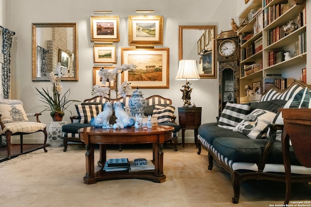 sitting room featuring carpet flooring