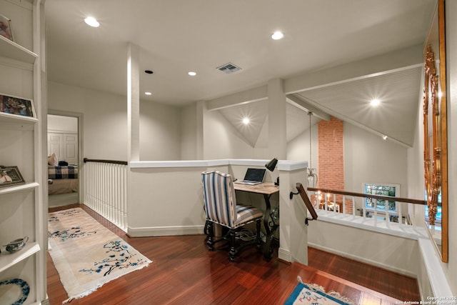 office space with dark hardwood / wood-style flooring and vaulted ceiling