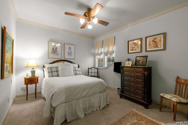 carpeted bedroom with ceiling fan and crown molding