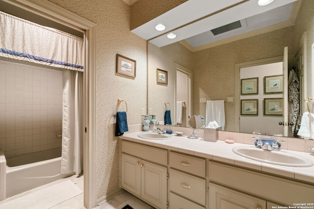 bathroom with tile patterned floors, vanity, shower / bath combo with shower curtain, and crown molding