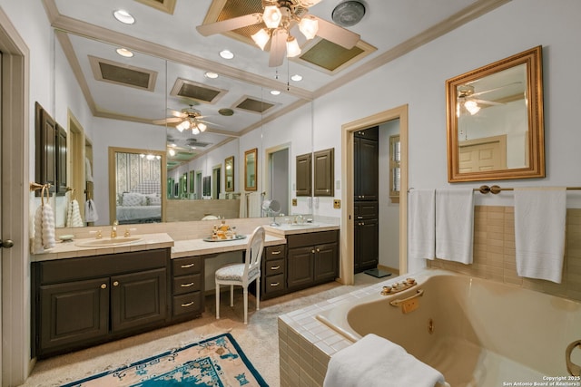 bathroom with vanity, a relaxing tiled tub, crown molding, and ceiling fan