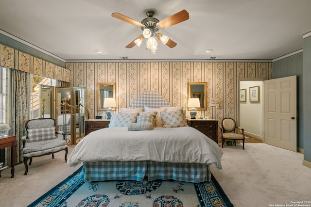 bedroom featuring ceiling fan, carpet floors, and ornamental molding