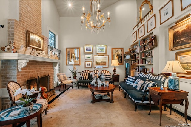 living area featuring a chandelier, a high ceiling, carpet flooring, and a brick fireplace