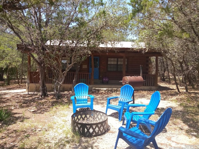 exterior space featuring an outdoor fire pit