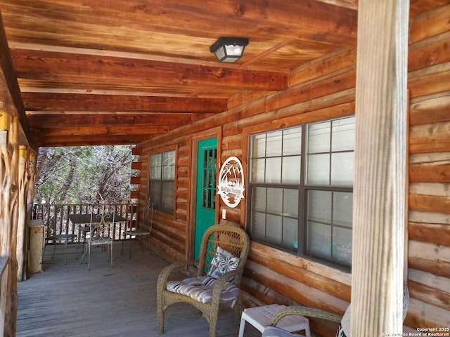 wooden terrace with a porch