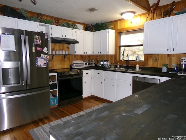 kitchen with black appliances, white cabinets, sink, a textured ceiling, and dark hardwood / wood-style flooring