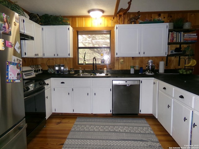 kitchen featuring sink, white cabinets, stainless steel appliances, and dark hardwood / wood-style floors