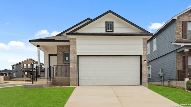 view of front facade with a garage and a front yard