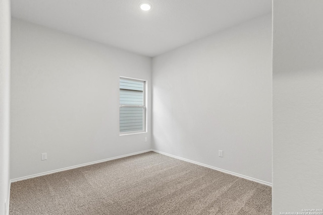 empty room featuring carpet floors