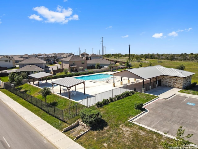 view of swimming pool with a lawn and a gazebo