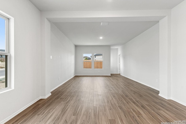 empty room with dark hardwood / wood-style floors