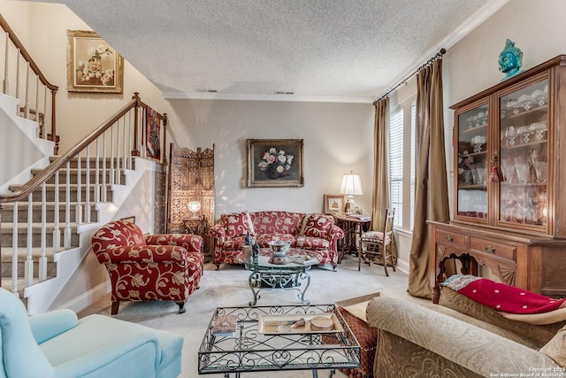 carpeted living room with a textured ceiling, a wealth of natural light, and crown molding