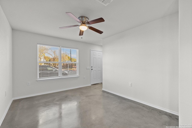 empty room featuring concrete flooring and ceiling fan